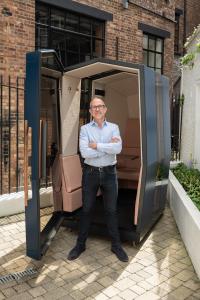 Walter Craven standing in front of a Kabin in London