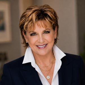 Larisa B. Miller, Founder and CEO of Phoenix Global, professional portrait in navy blazer.
