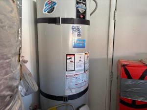 Water Heaters Today LLC shows a water heater ready for installation in a residential home
