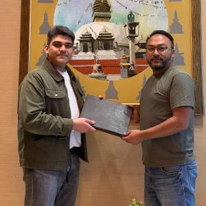 Abhishek Bali of ZIGRAM and Amit Joshi of AMNIL Technologies holding a partnership agreement during the official strategic collaboration announcement.