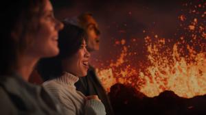 Happy and excited people experiencing the Volcano Ride at Volcano Express