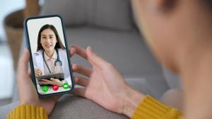 photo of a client on a smart phone talking with a health care professional on a telehealth call