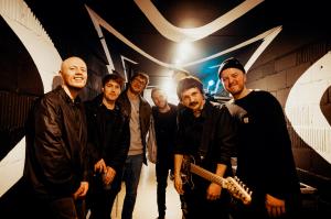 Music publicist David Sullivan backstage with artists at Ancienne Belgique venue in Brussels during a live tour date in 2024.