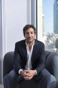 Algebra.ai co-founder and CEO, Anis Harb sitting on a chair leaning forward