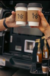Tribe coffee cups cheering at the event