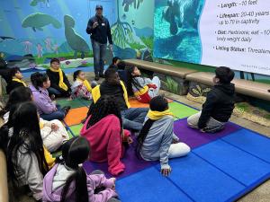 Palm Beach Maritime Academy students participate in a hands-on marine science lesson, examining marine specimens as part of the school's STEAM curriculum.