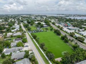 Aerial view of Palm Beach Maritime Academy's Lantana campus, including classroom buildings, athletic fields and nearby residential streets.