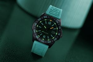 Luminox Pacific Diver 3120 Transformative Teal on a shiny surface with a teal shape in the background