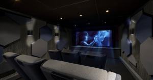 Custom home theater installation with projection screen and theater seating by IntegrateIT in Kansas City