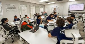 Instructional classroom setting at Olympus College Prep with students and Founder/Director Aydin Mehrage