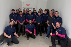 uniformed plumbers from Mother Modern Plumbing celebrate their 2026 Best in DFW nomination