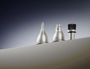 Aecooly Cold Air Ultra magnetic accessory nozzles and cleaning brush displayed on a product surface