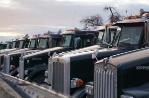 Commercial trucks on the road highlighting career opportunities in transportation and logistics through the LeFrak CDL Training Initiative supported by the Francine A. LeFrak Foundation and the New Jersey Reentry Corporation.