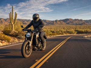 Arizona motorcyclist riding on desert highway - Phillips Law Group HB2109 motorcycle safety