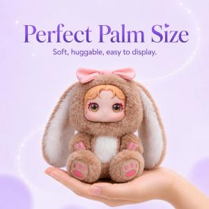 Palm-sized personalized plush keepsake from SnapFig held in one hand, soft and huggable with long bunny ears.