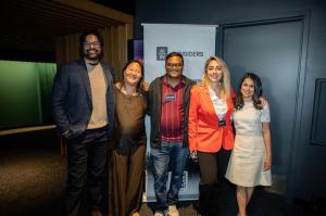 A group of five people standing together in front of an AI Insiders banner at the Cybersecurity event in San Francisco.