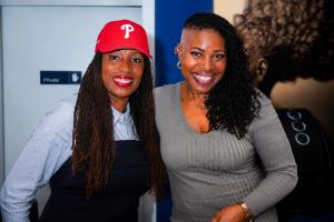 Charmaine James, Founder of Locsanity (left), and Candace Smith, owner of Asayah Loc Nurturing & Styling Salon, celebrate entrepreneurship and community partnership during the Locsanity All Across America Tour stop in Philadelphia.