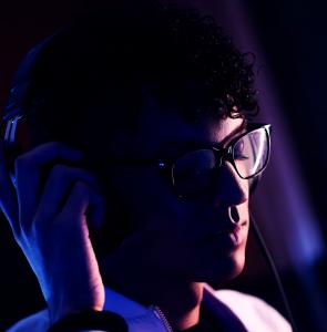Danny with headphones on photographed by Daniel Miller