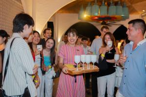Casa Boho team serving welcome drinks to guests during Meet the Game Changers.