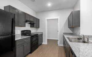 Spacious apartment kitchen with modern appliances at Reserve At Mott.