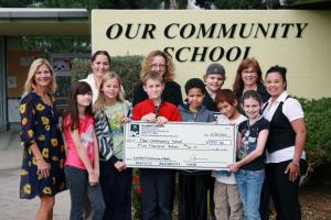 Planet Green Awards Oversized Check to school for ink cartridge recycling