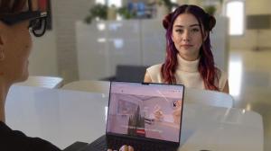 A person wearing XR glasses speaking face to face with MATSUMI, a holographic AI human presence anchored in their physical space.