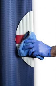Photo of hand using CPULL with Micrillon to pull back a hospital curtain