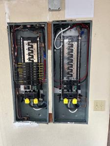 Two Electric Panels About to Be Worked on by Melby Electric