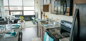 This is the interior of one of the common spaces inside a unit, including the kitchen and living room