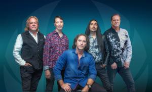 A photo of the band Already Gone, five handsome dudes, from L to R: Jay Bourgeois, Harry Ochsenbein, Johnny Ono, Paul Sarver, Clint Springer (seated)