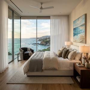 Floor-to-ceiling ripple fold sheer curtains in a Malibu luxury residence, providing privacy, light diffusion, and unobstructed ocean views.