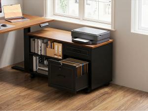 OffiGo standing desk side cabinet with open shelves, file drawer, hanging folders, books, and printer beside an L-shaped wood desktop.