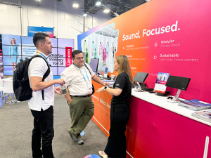 AV professionals experiencing Audfly directional audio demonstrations at Booth C9870