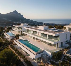 Contemporary luxury development under construction on Marbella hillside showing premium residential architecture with Mediterranean sea views