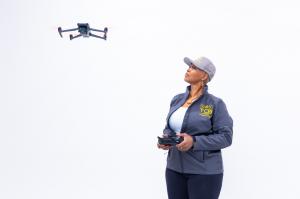 Steffanie Rivers operating a commercial drone while promoting innovation, FAA certification, workforce development, and career opportunities within the drone industry.