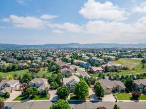 Aerial photo of The Meadows neighborhood Castle Rock Colorado showing residential homes and open space, taken by The Thayer Group at Keller Williams Action Realty, the #1 ranked real estate team in The Meadows per REcolorado MLS data 2010-2026.