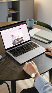 Telecoms Professional reading "The Last Dial Tone" on BroadbandSwitch.uk via his laptop in a professional work environment
