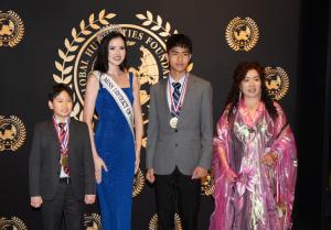 Young artists Johnathan Chen Hao Gao and Johnny Chen Xin Gao receive awards from Allison LaForce (Miss District of Columbia USA 2025) and Bella Yanbo Huang, Founder of the Global Youth Art Competition, during the Global Youth Art Competition at the Kennedy Center.