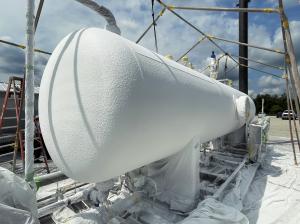 A heater treater coated with Sherwin-Williams Heat-Flex® AEB - a sprayed thermal insulative coating that replaces traditional insulation to prevent corrosion under insulation (CUI) on hot process assets.