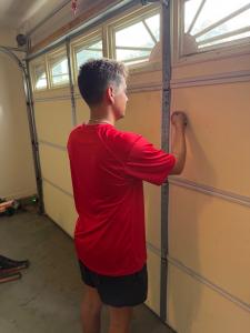 Putting on final touches on homeowners door