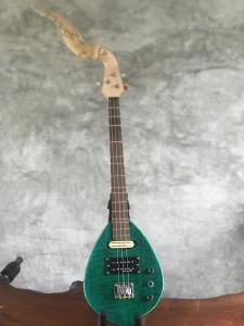 Green handcrafted electric Phin made by Master Vee, featuring a carved decorative headstock, wooden neck, two pickups and control knobs.