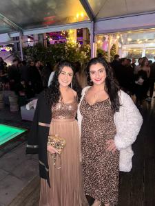 Farrah Mechael and Tamara Mechael posing together at an evening entertainment industry event.
