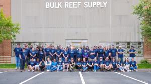 Team members at Bulk Reef Supply gather in front of the warehouse in Golden Valley, Minnesota to celebrate being chosen for Reef2Reef Awards.