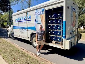 Trevor Hand standing in front of Artezia Truck