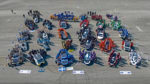 Aerial view of collegiate teams assembled with their solar-powered vehicles at the Electrek American Solar Challenge.