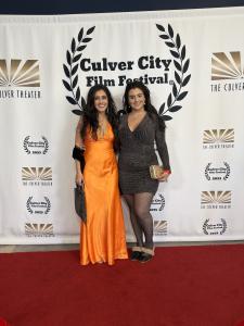 Farrah Mechael and Tamara Mechael posing together on the red carpet at the Culver City Film Festival.