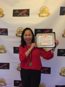 Dr. Linda celebrating her literary milestones award during the award ceremony in Mexico for achieving #I International Bestselling status. Photo: Dr. Linda Duong.