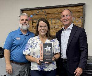 Photo of the Platinum Copier Solutions team receiving the 2025 GreatAmerica Premier Partner Award