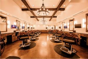 Luxury barber stations inside a The Gents Place men's grooming and lifestyle club.