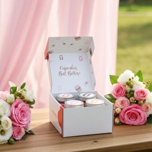 Jarlicious Cupcakes 4-pack on wedding table surrounded by pink flowers.
